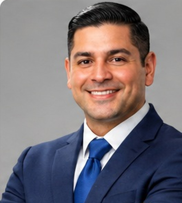 Alexander Gomez portrait on neutral gray background